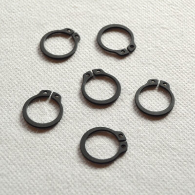 Låsering for krumtap før koblingsskål